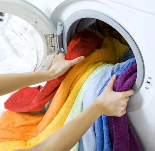 Freshly folded clean premium clothes at Deli Laundry in Munirka, New Delhi