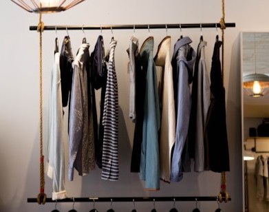 Branded apparel neatly displayed in a premium clothing showroom