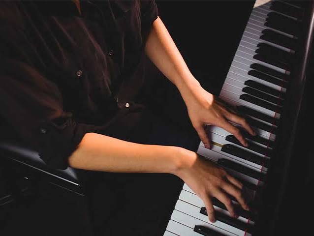 Student learning piano and keyboard with sheet music and metronome at SAZ music academy Pimple Saudagar