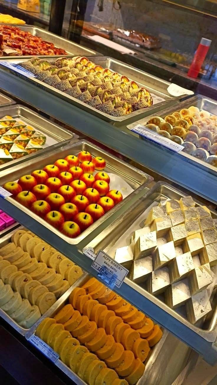 Assorted traditional Indian sweets at Raju Misthan Bhandar sweet shop in Ferozpur Jhirka
