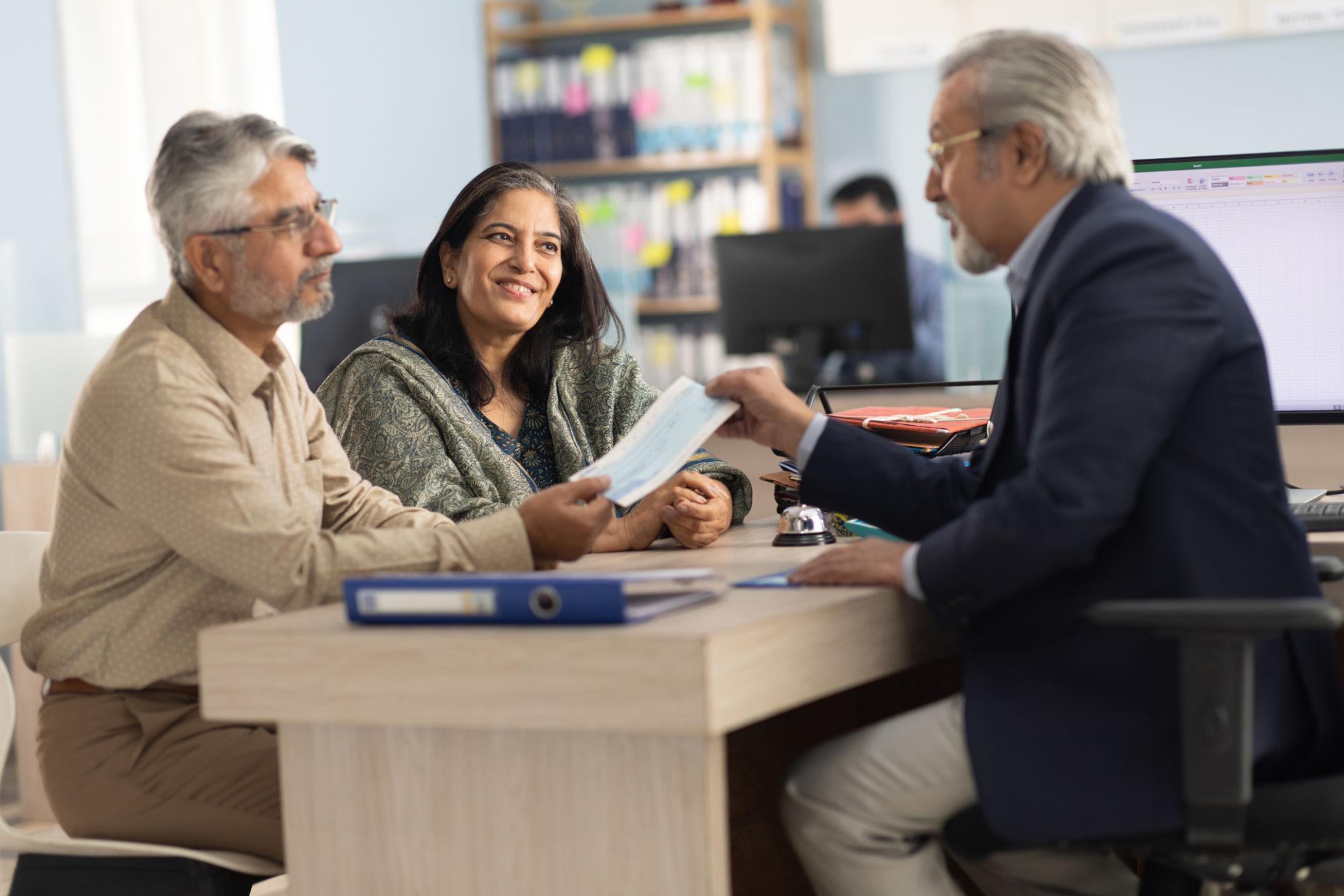 Financial documents and consultation materials representing FAQ and client guidance at Ojha Financial Services
