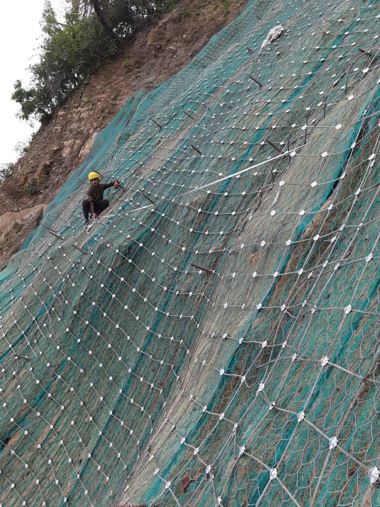Green slope stabilization using geosynthetics