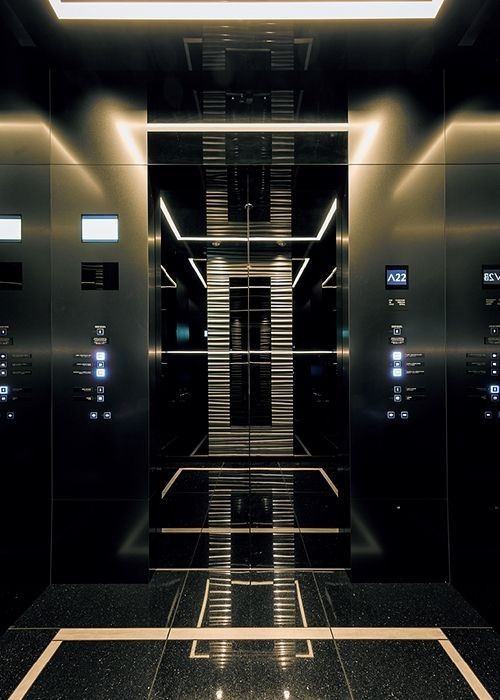 Elevator technician inspecting safety components