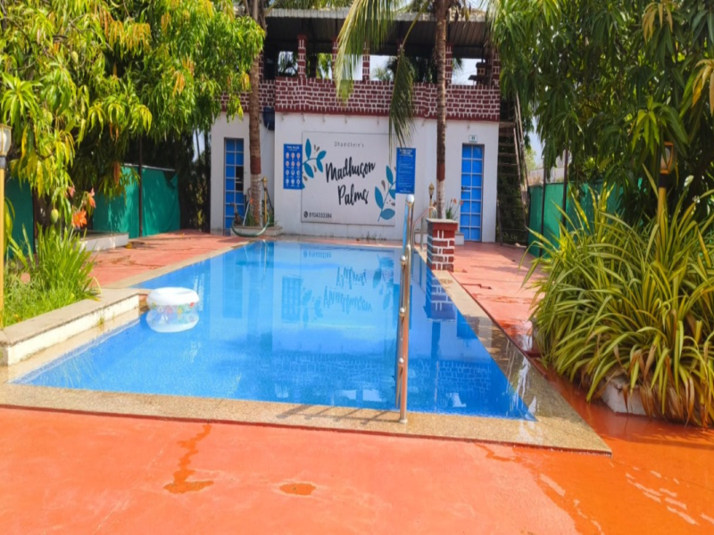 Swimming pool at Madhuson Palms family homestay in Karjat