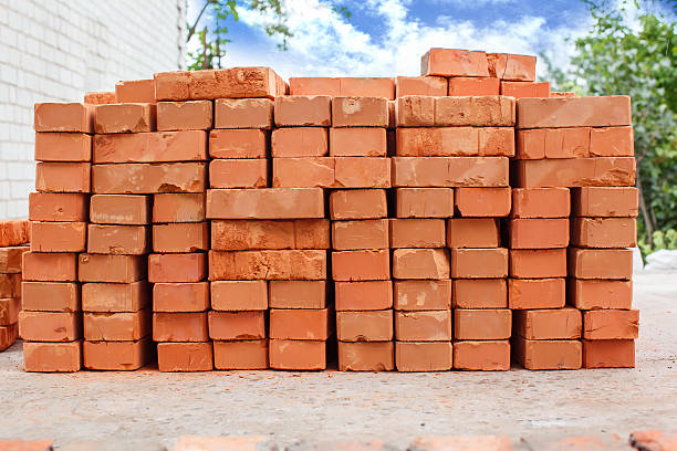Stacked red bricks for wall masonry and building construction