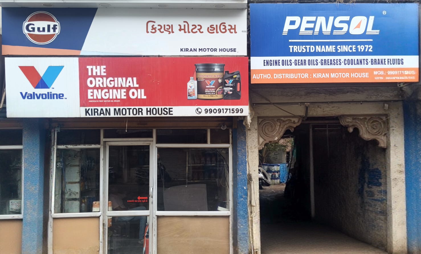 Mechanic checking engine oil at Kiran Motor House in Bhavnagar